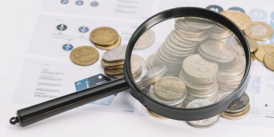 magnifying-glass-fallen-coins-infographic-template